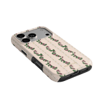 Blackberry iPhone case featuring a floral design with pink roses on a cream background, angled view showing camera cutout.