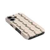 Blackberry iPhone case featuring a floral pattern with pink roses on a cream background, angled view showing buttons and p...