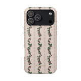 Blackberry iPhone case featuring a floral pattern with purple flowers and green leaves on a light background.