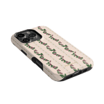 Blackberry iPhone case featuring a floral design with roses on a cream background, angled view showing buttons and camera ...