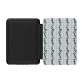 Blackberry Kindle case with a floral pattern on a light blue background and a black interior.