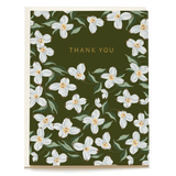 Blue Dogwood thank you card featuring white flowers on a dark green background with gold text.