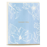 Blue floral thank you card featuring white flowers and gold text on a light blue background.