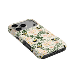 Bumblebee iPhone case featuring floral patterns with bees on a light background, angled view showcasing camera cutout.