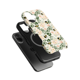 Bumblebee iPhone case featuring a floral design with bees on a light background, layered over a black phone case.