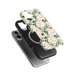 Bumblebee iPhone case featuring floral design with bees, layered over a black protective case on a green background.