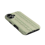 Camellia iPhone case featuring a floral pattern on a light green background, angled to show side and button details.