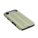 Camellia iPhone case featuring a floral design on a light green background with black edges.