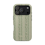 Camellia iPhone case featuring a green background with floral patterns and stripes, designed for iPhone models.