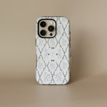Clover personalized iPhone case featuring a floral design in blue and gray with a monogrammed letter T.