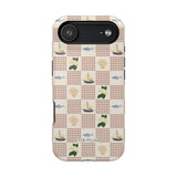 Coastal iPhone case featuring a nautical pattern with boats, fish, and seashells on a cream background.