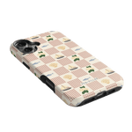 Coastal iPhone case featuring a checkered pattern with boats, trees, and sailboats in soft colors on a light background.