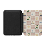 Coastal Kindle case featuring a patterned design with fish, sailboats, and seashells on a light background.
