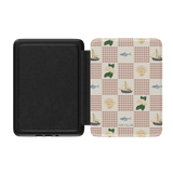 Coastal Kindle case featuring a patterned design with fish, sailboats, and seashells on a light background.
