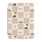 Coastal Kindle case featuring a patchwork design with boats, fish, shells, and floral patterns on a cream background.