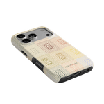 Curio iPhone case featuring a textured design in pastel colors with a black edge, angled to show camera cutout.