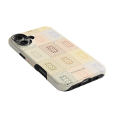 Curio iPhone case featuring a textured design with colorful squares on a light background.