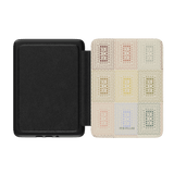 Curio Kindle case with a black exterior and a patterned interior featuring colorful rectangles in various shades.