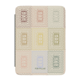 Curio Kindle case featuring a colorful geometric pattern in pastel shades on a light background.