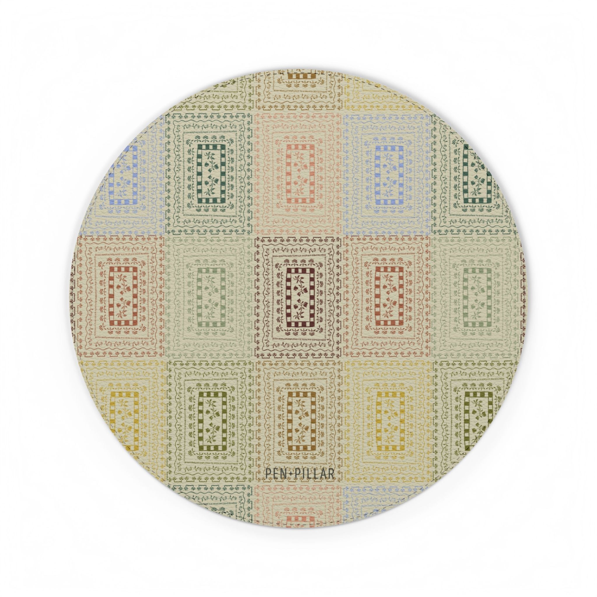 Curio mouse pad featuring a circular design with a colorful geometric pattern in pastel shades.