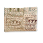Curio woven blanket featuring a textured, multi-colored pattern in earthy tones, neatly folded.