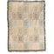 Curio woven blanket featuring a geometric pattern in soft pastel colors with fringed edges.