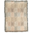 Curio woven blanket featuring a geometric pattern in soft pastel colors with fringed edges.
