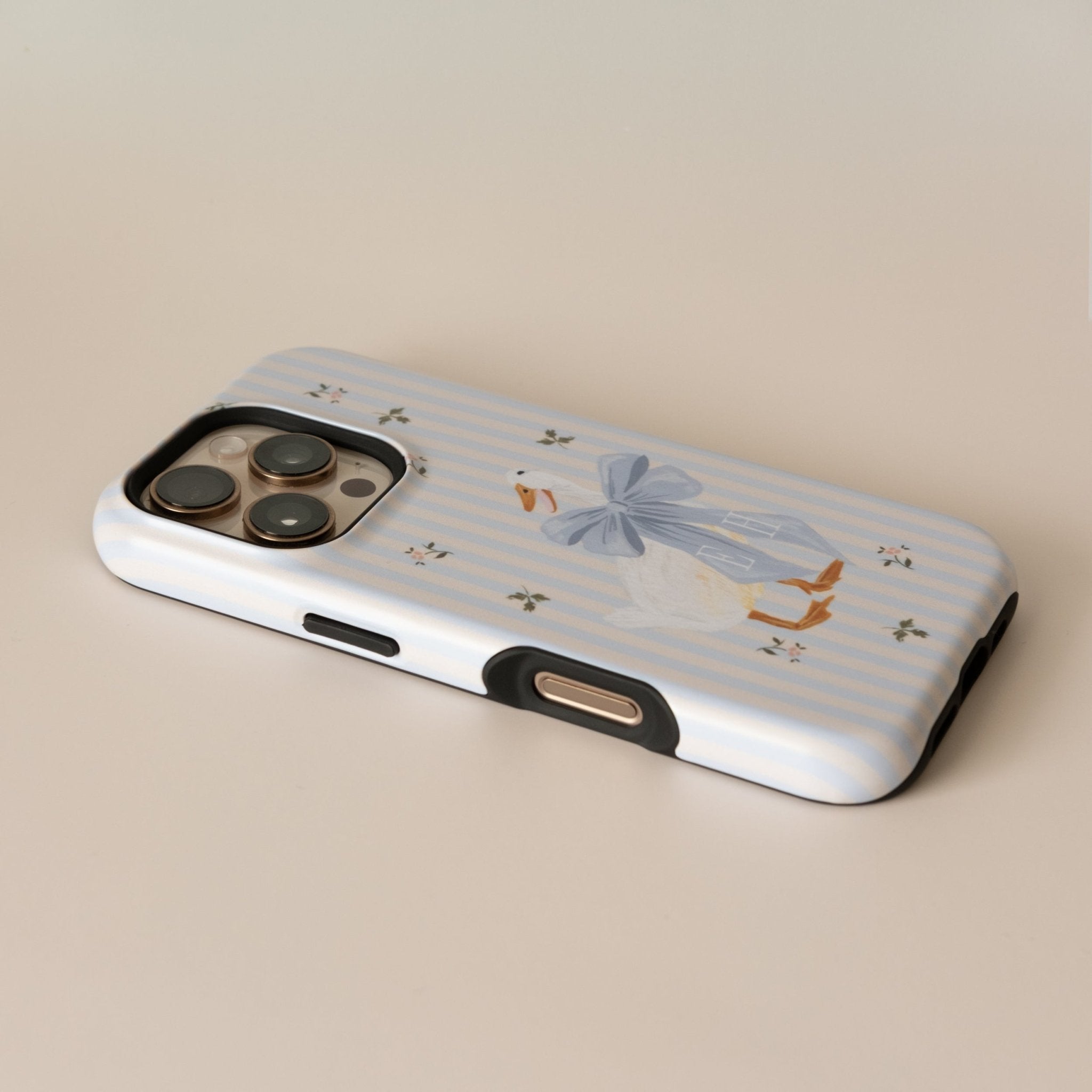 Dainty Duck personalized iPhone case with a blue striped background and a duck illustration wearing a bow.