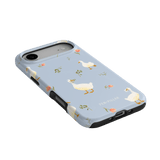 Ducks iPhone case featuring a light blue background with illustrated ducks and floral accents.