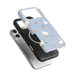 Ducks iPhone case featuring a light blue background with white ducks and floral patterns, stacked with a black case.