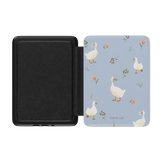 Ducks Kindle case with a light blue background and white ducks among floral patterns, open to show interior.