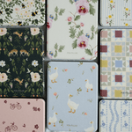 Ducks Kindle case featuring a light blue background with white ducks and floral accents, part of a patterned collection.