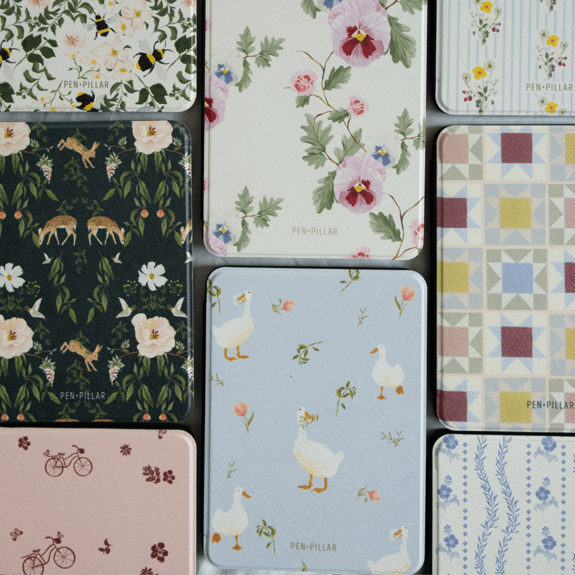 Ducks Kindle case featuring a light blue background with white ducks and floral accents, part of a patterned collection.