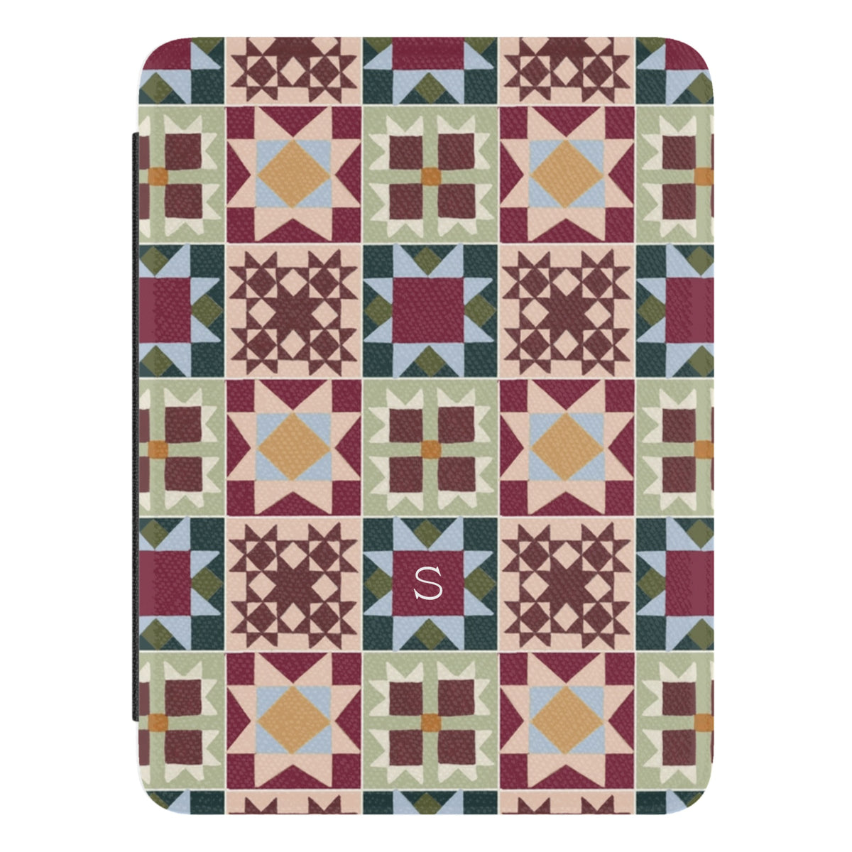 Sugarplum Personalized Kindle case, close-up of the front: quilt blocks in burgundy, forest green, blush and gold with the initial S