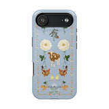 Farmland iPhone case featuring a blue background with floral designs, animals, and farm-themed illustrations.