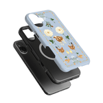 Farmland iPhone case featuring a light blue background with floral and animal designs, stacked with a black case.