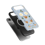 Farmland iPhone case featuring a light blue design with floral patterns, cows, and chickens on a black background.