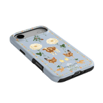 Farmland iPhone case featuring a blue background with floral designs, cows, and chickens.