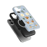 Farmland iPhone case featuring a light blue design with flowers, cows, and chickens on a black and silver background.