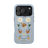 Farmland iPhone case featuring a blue background with floral designs, cows, chickens, and decorative elements.