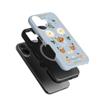 Farmland iPhone case featuring a light blue background with floral and animal illustrations, stacked with a black case.