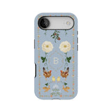 Farmland personalized phone case featuring floral and chicken designs on a light blue background with a monogrammed letter B.