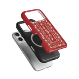 Fiona iPhone case featuring a red floral design, stacked with a black and a clear case on a green background.