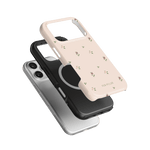 Forage iPhone case featuring a floral design in pink, black, and clear colors, stacked at various angles.