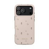 Forage iPhone case in soft pink with small floral patterns and black camera cutout.