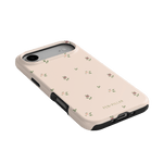 Forage iPhone case featuring a light pink background with small floral patterns and black edges.