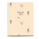 Forage thank you card featuring a light peach background with floral designs and "Thank You" text in blue.