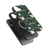 Forest iPhone case featuring a floral and deer design on a dark green background, layered over a black phone case.