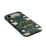 Forest iPhone case featuring a dark green background with floral patterns and deer illustrations.