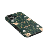 Forest iPhone case featuring a dark green background with floral and deer patterns.